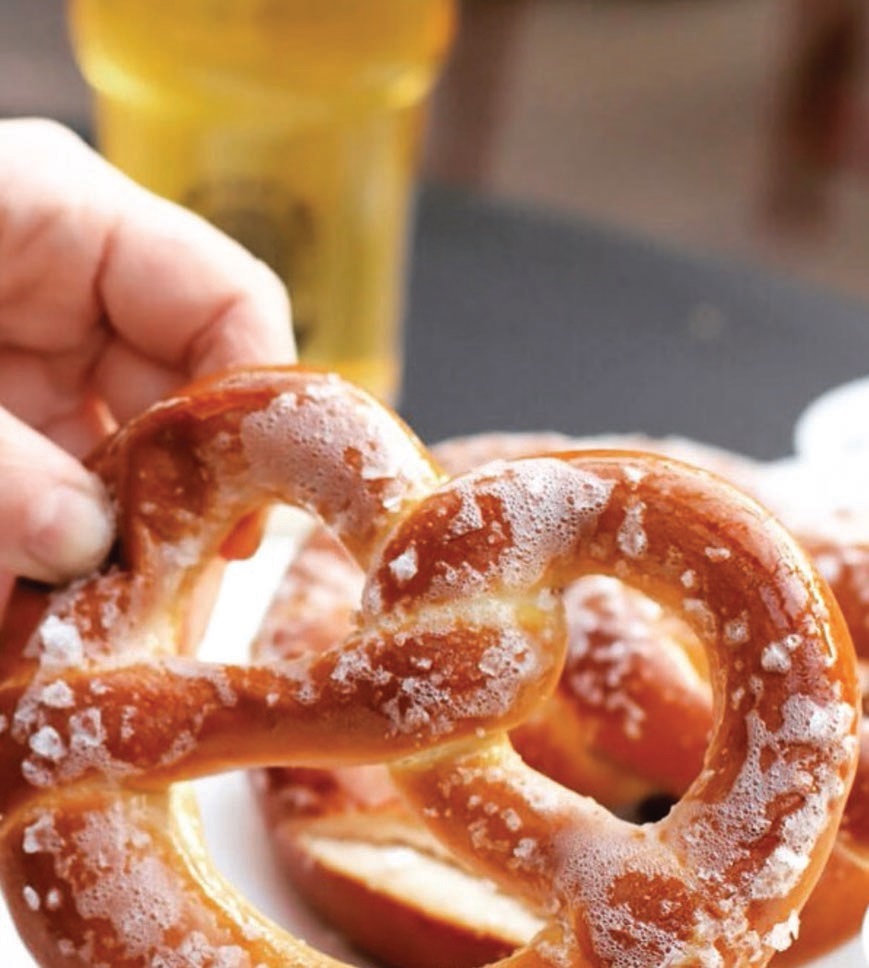 At Chestnut Hill Brewing Company, the soft pretzel trio with spicy vegan beer cheese and Dijon mustard is a must for those who like a little heat. PHOTO BY DANIEL BERRET