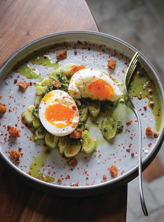 Coal-roasted leeks, salsa verde and croutons with six-minute eggs PHOTO BY: STEVE LEGATO