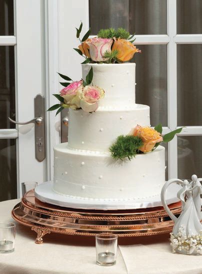 The three-tiered amaretto and vanilla icing cake Photographed by Elba Dipp, Dipp Photography