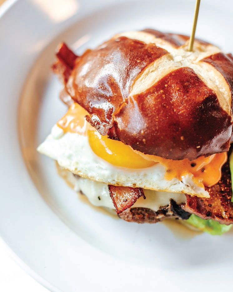 Brunch at Emmy Squared is elevated with a pretzel bun burger. PHOTO BY: KELLI LAMANTIA