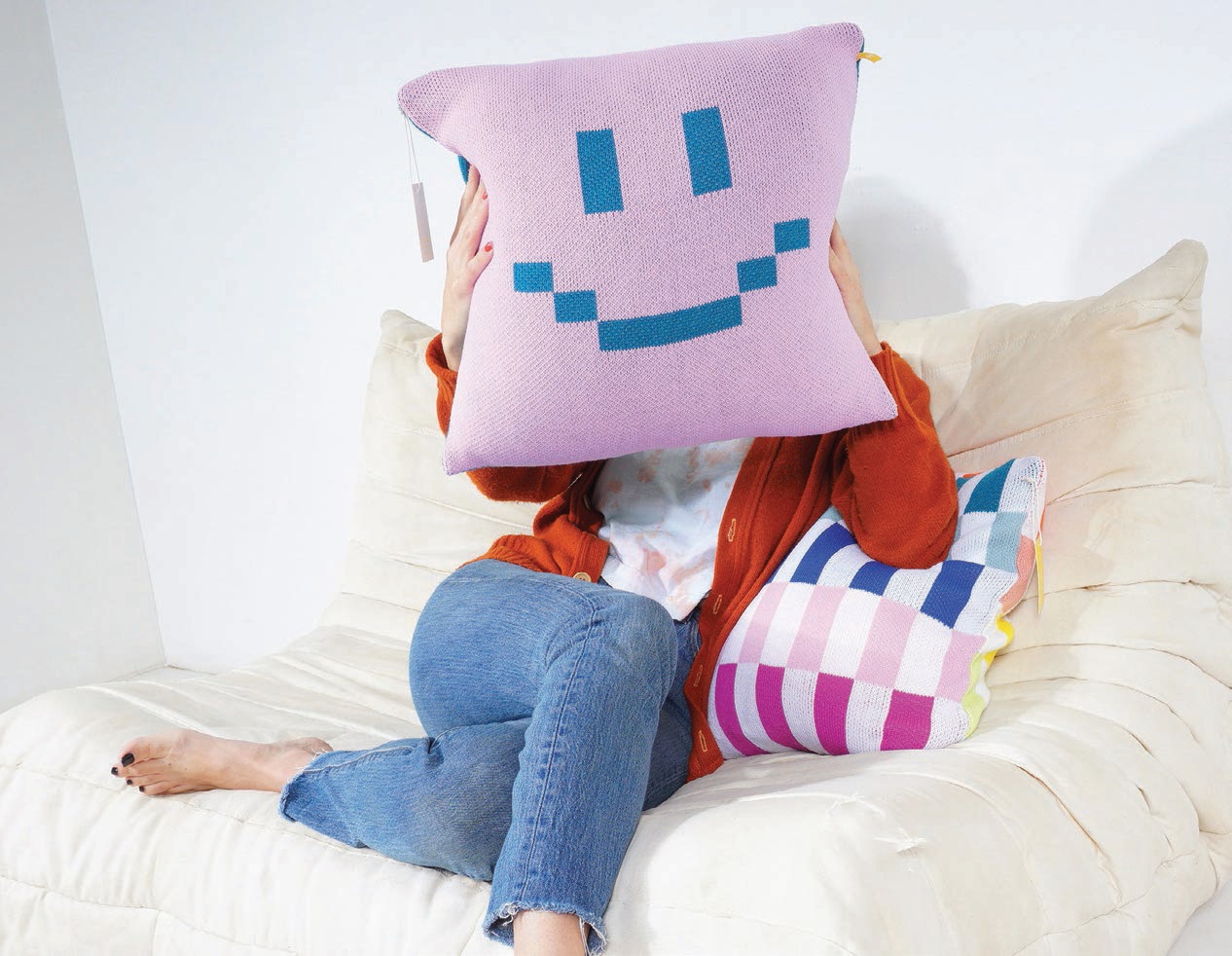 Betsu Studio’s colorful pixel smile and checkerboard pillows. PHOTO: BY BETSU STUDIO
