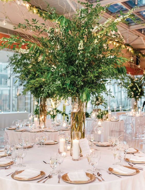 The centerpieces at Water Works will feature an abundance of greenery (such as this cascading arrangement by Carl Alan Floral Designs) with blush-toned blooms scattered throughout. carlalan.com CENTERPIECE PHOTO BY EMILY WREN