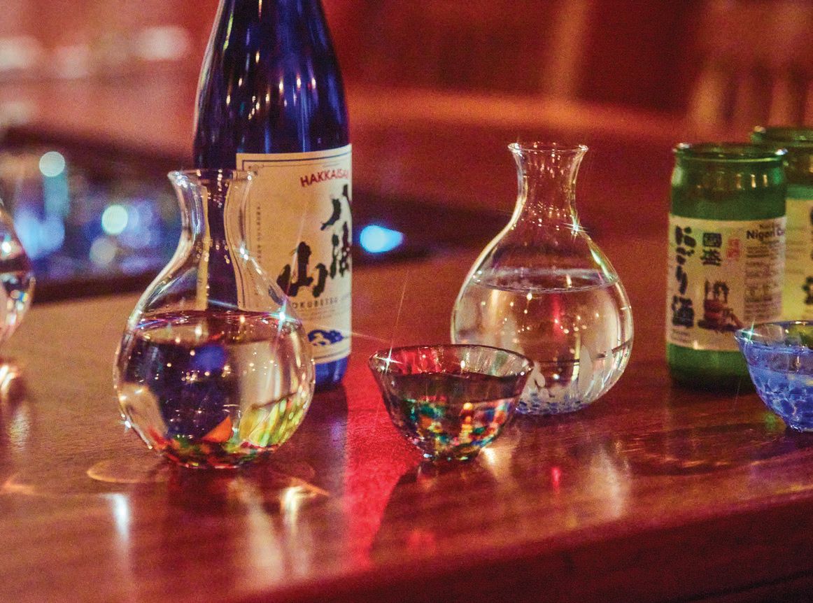 A variety of Japanese whisky and sake line the shelves of Ito’s bar PHOTO COURTESY OF JESSE ITO  SAKE PHOTO BY CASEY ROBINSON