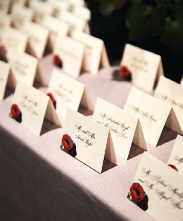 Escort cards were designed by The Papery to match the bright florals Photographed by Philip Gabriel Photography