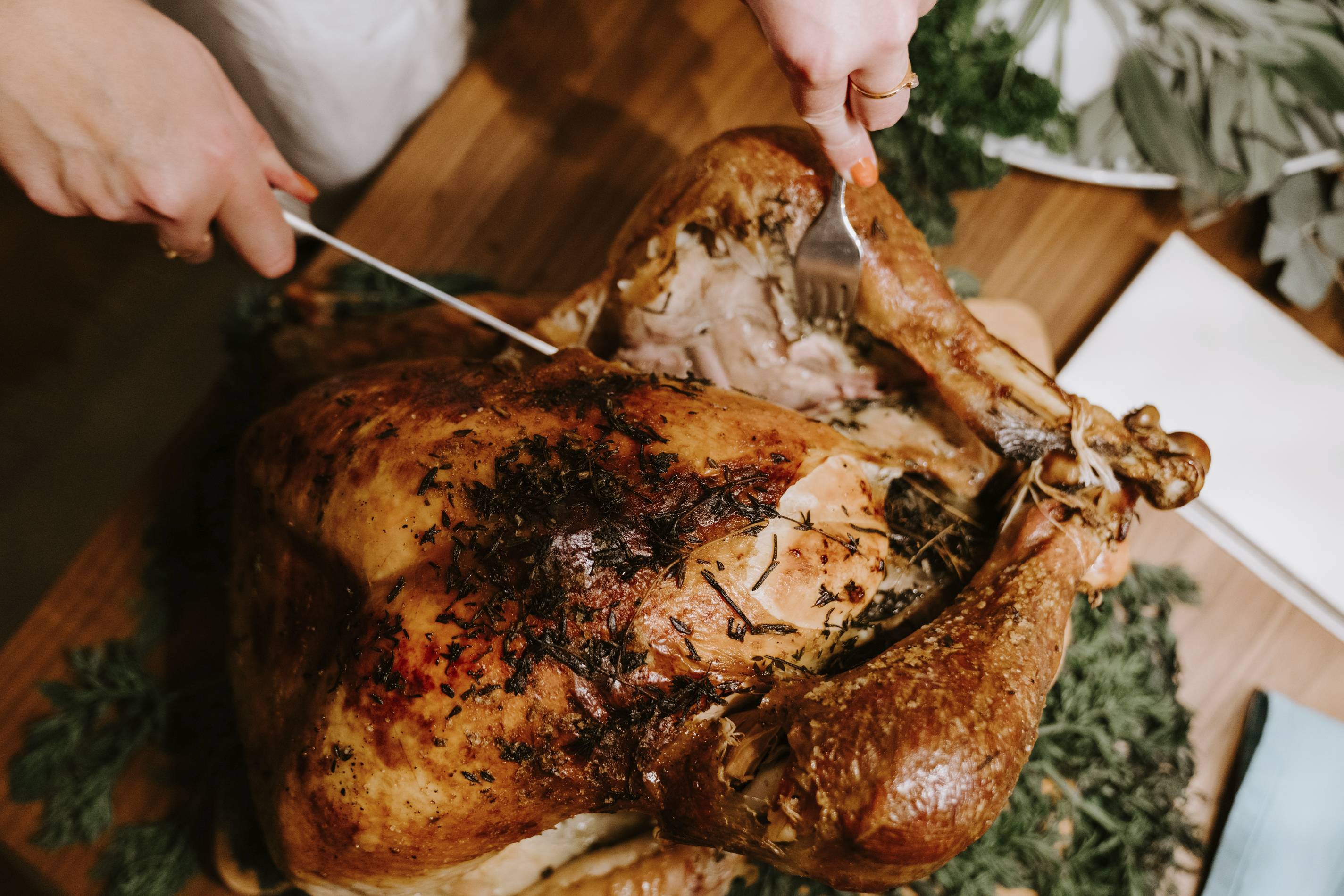 A man carves Thanksgiving turkey